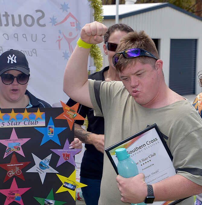 Young person with disability getting an award