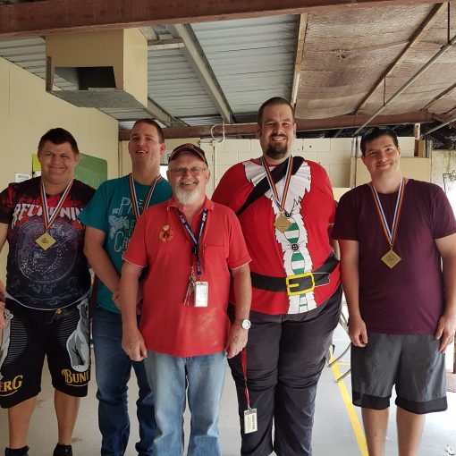 One SCSS care provider with 4 men that got medals on excursion