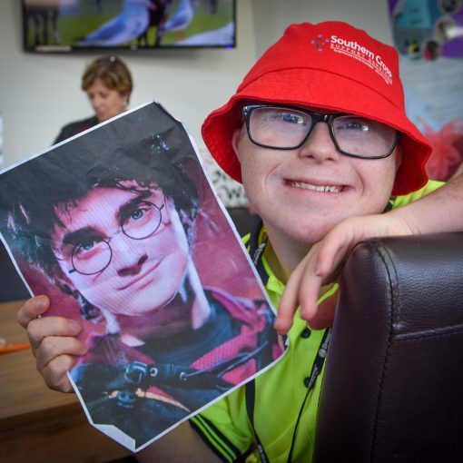 Boy showing picture of Harry Potter at SCSS behaviour support program