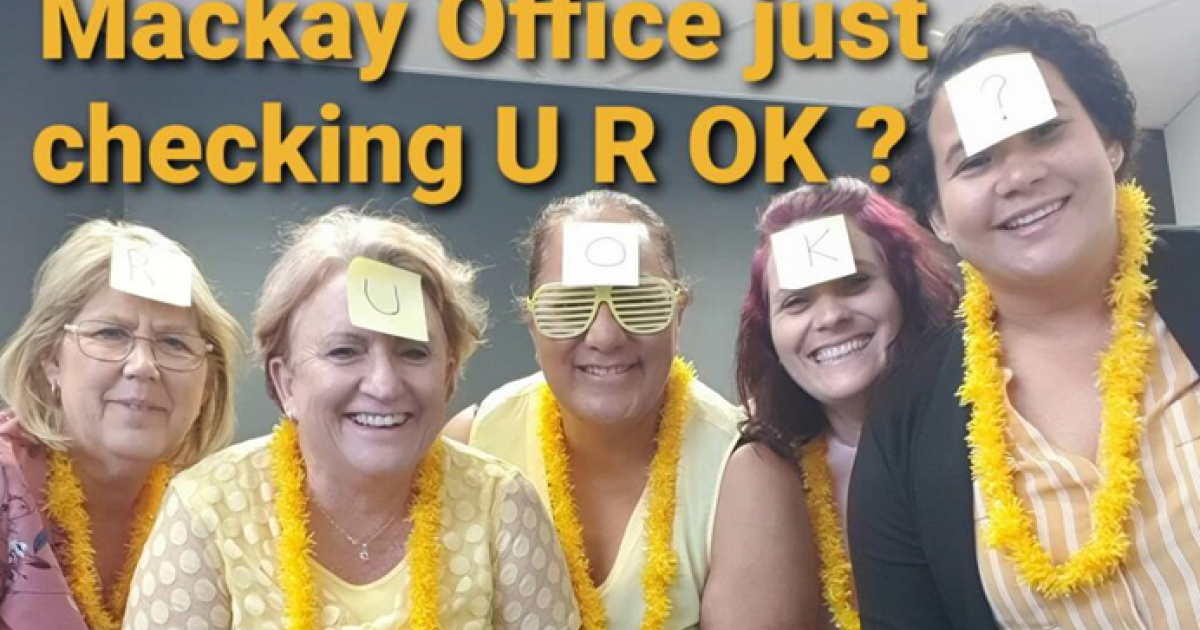5 ladies wearing yellow with stickers on faces RUOK?