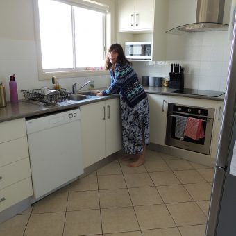 Client washing dishes